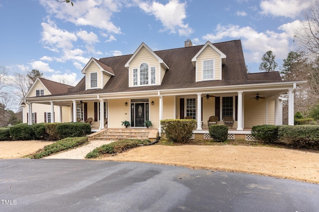 view of front of home with a porch and ceiling fan