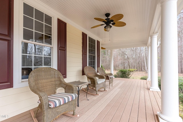 wooden terrace featuring a porch and a ceiling fan