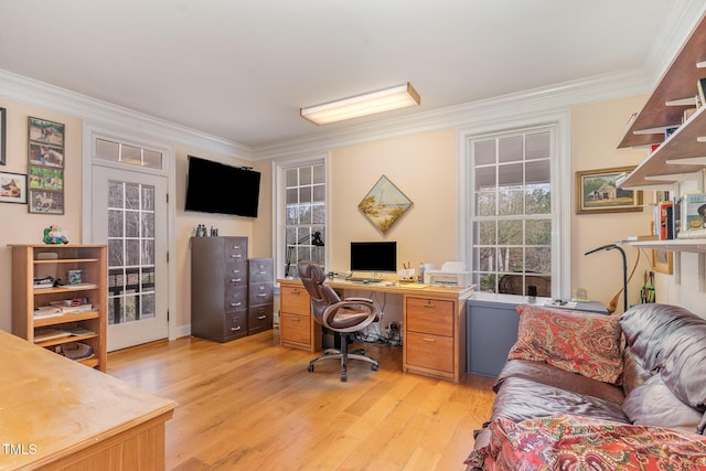 office with a healthy amount of sunlight, ornamental molding, and light wood finished floors