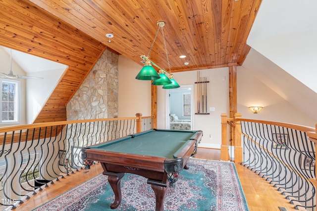 recreation room with wood finished floors, wood ceiling, a ceiling fan, and lofted ceiling