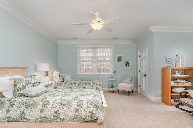 carpeted bedroom featuring baseboards, a ceiling fan, and crown molding