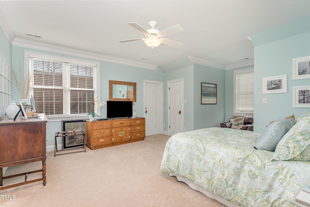 bedroom featuring crown molding, carpet flooring, baseboards, and visible vents