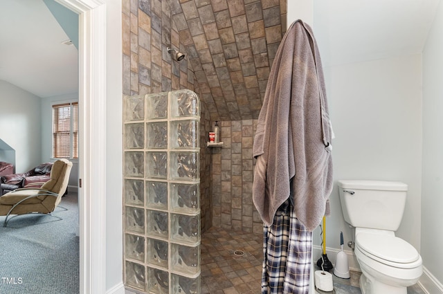 full bath featuring baseboards, toilet, and walk in shower