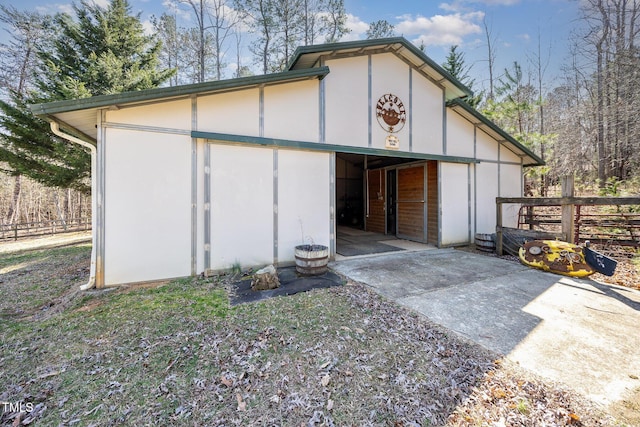 view of outbuilding with an outbuilding and concrete driveway