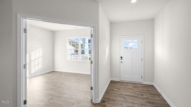 entrance foyer featuring wood finished floors and baseboards