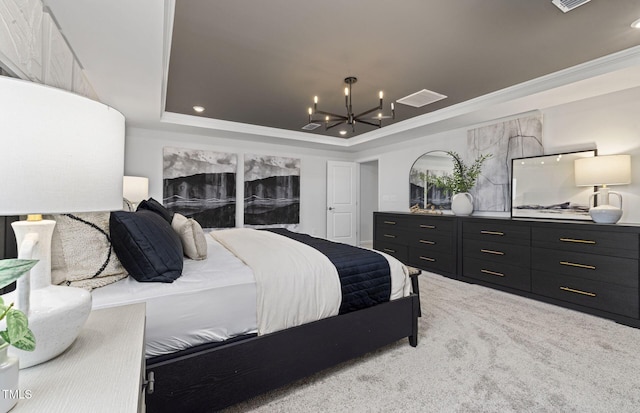 carpeted bedroom featuring a tray ceiling, an inviting chandelier, crown molding, and visible vents