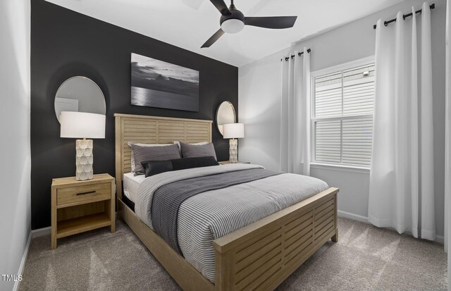 carpeted bedroom with baseboards and ceiling fan