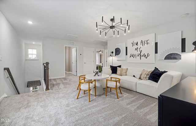 living area with visible vents, carpet, attic access, recessed lighting, and an inviting chandelier