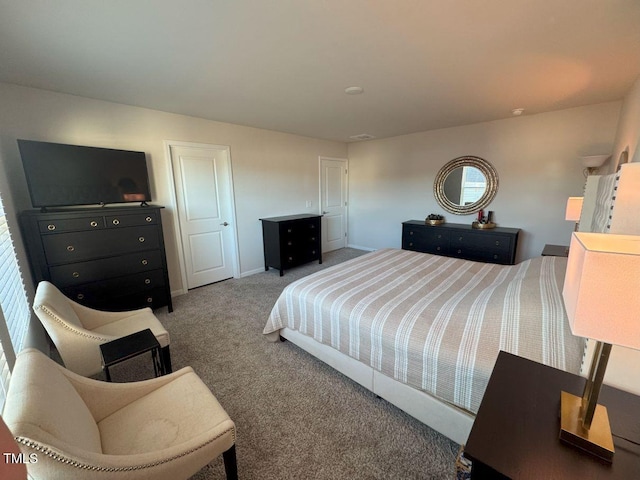 bedroom featuring baseboards and carpet flooring