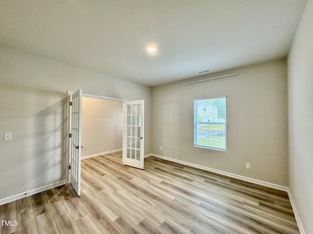768 Riguard Way, Wendell, NC 27591 - spare room with french doors, wood finished floors, baseboards, and recessed lighting