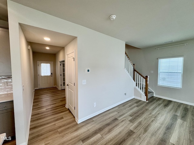 768 Riguard Way, Wendell, NC 27591 - interior space featuring light wood-style flooring, stairs, baseboards, and recessed lighting