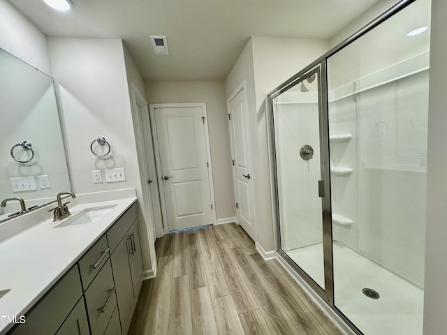 768 Riguard Way, Wendell, NC 27591 - full bath featuring wood finished floors, a stall shower, vanity, and baseboards