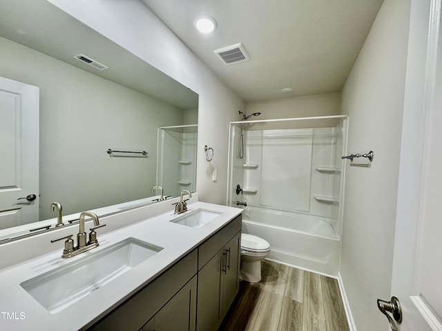 768 Riguard Way, Wendell, NC 27591 - full bathroom with wood finished floors, bathing tub / shower combination, toilet, double vanity, and baseboards
