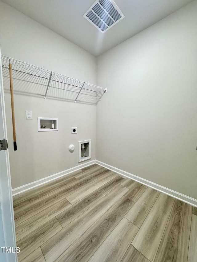 768 Riguard Way, Wendell, NC 27591 - clothes washing area with hookup for an electric dryer, gas dryer hookup, washer hookup, and wood finished floors