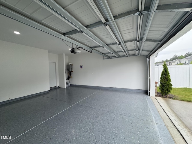 768 Riguard Way, Wendell, NC 27591 - garage featuring a garage door opener, baseboards, and recessed lighting