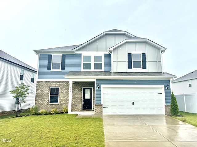 768 Riguard Way, Wendell, NC 27591 - view of front of home featuring concrete driveway, a garage, board and batten siding, and brick siding