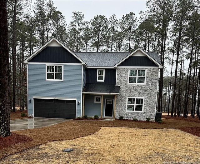 view of front of home featuring central air condition unit, board and batten siding, concrete driveway, and a garage