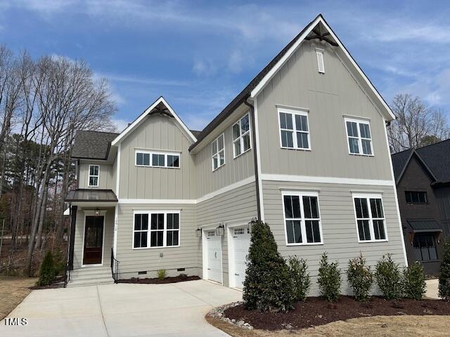 view of front of home featuring concrete driveway, an attached garage, board and batten siding, and crawl space