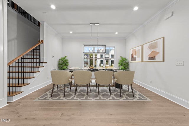 12912 Grey Willow Dr, Raleigh, NC 27613 - dining area with crown molding, stairs, wood finished floors, recessed lighting, and baseboards