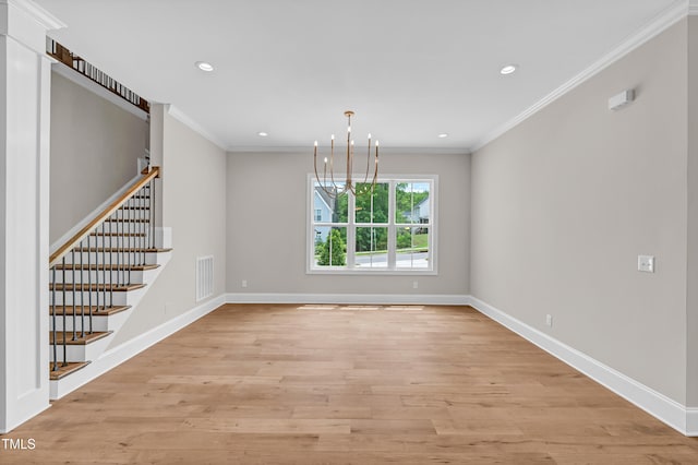 12912 Grey Willow Dr, Raleigh, NC 27613 - empty room with a chandelier, crown molding, stairway, light wood-style floors, and baseboards