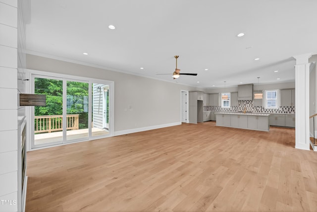 12912 Grey Willow Dr, Raleigh, NC 27613 - unfurnished living room with plenty of natural light, baseboards, ornamental molding, ceiling fan, and recessed lighting