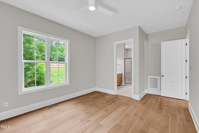 12912 Grey Willow Dr, Raleigh, NC 27613 - unfurnished bedroom featuring baseboards, light wood finished floors, ceiling fan, and ensuite bathroom
