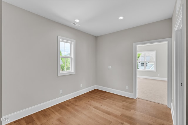 12912 Grey Willow Dr, Raleigh, NC 27613 - unfurnished room with baseboards, light wood-type flooring, and recessed lighting