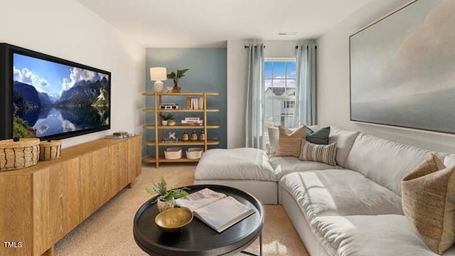 living area featuring light colored carpet