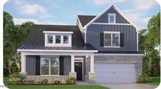 view of front facade with metal roof, a garage, stone siding, driveway, and a standing seam roof