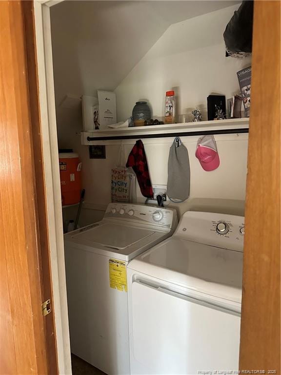 clothes washing area with washer and dryer and laundry area