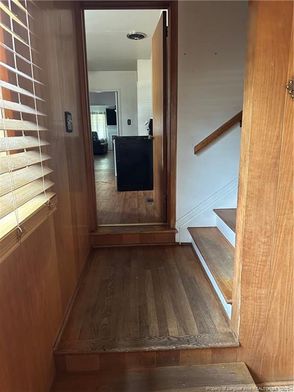 interior space featuring wood finished floors and stairs