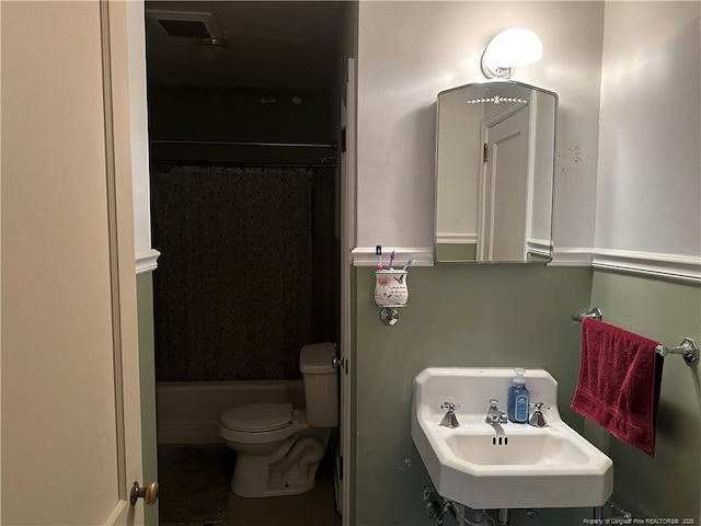 full bathroom featuring toilet, bathing tub / shower combination, and a sink