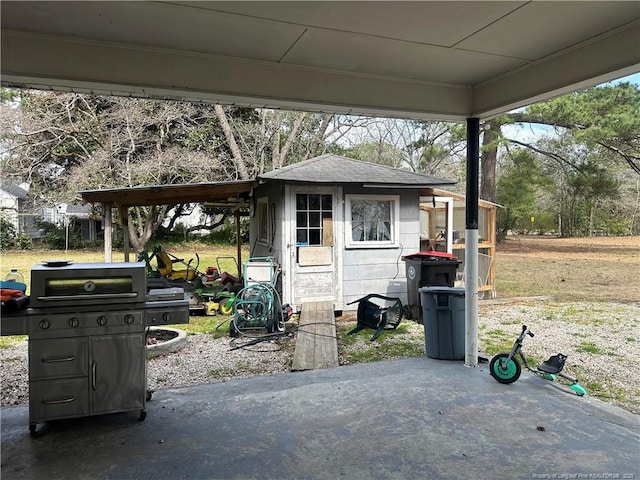 exterior space with grilling area and an outdoor structure