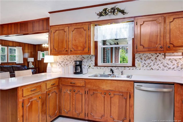 kitchen with a sink, brown cabinets, and dishwasher