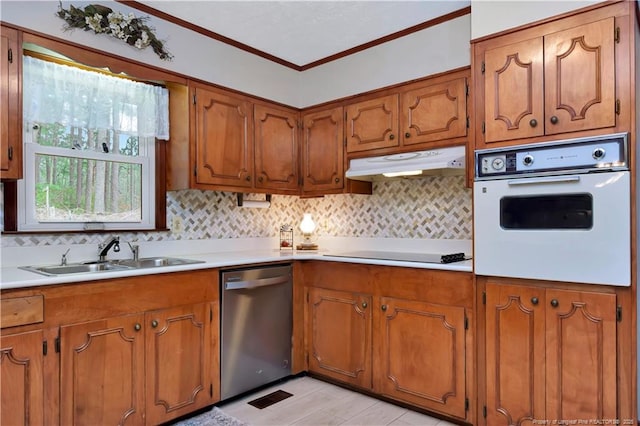 kitchen featuring under cabinet range hood, a sink, stainless steel dishwasher, white oven, and black electric stovetop