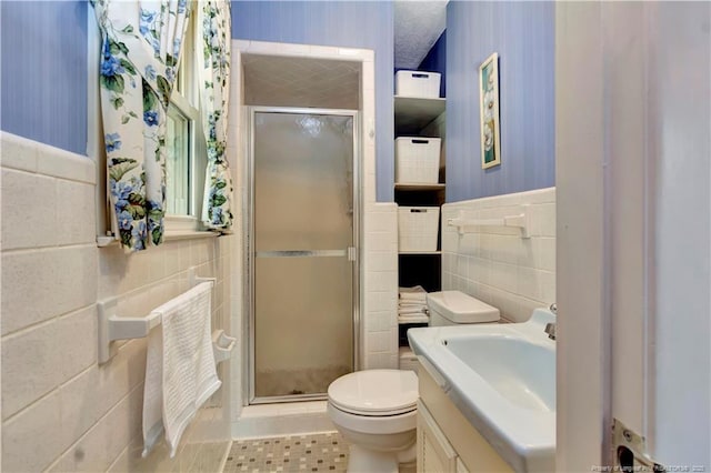 full bath featuring toilet, a stall shower, wallpapered walls, and tile walls