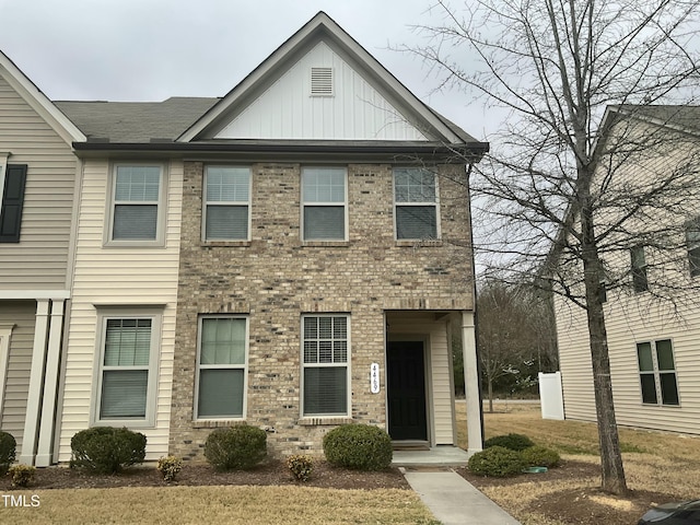 multi unit property featuring brick siding and board and batten siding