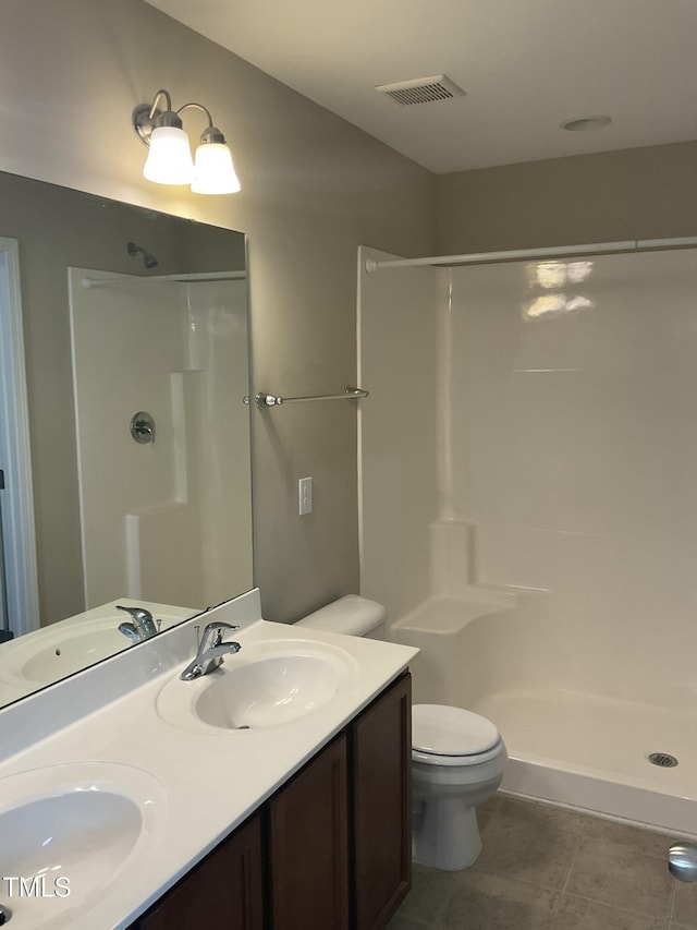 full bathroom featuring a sink, visible vents, a stall shower, and tile patterned flooring