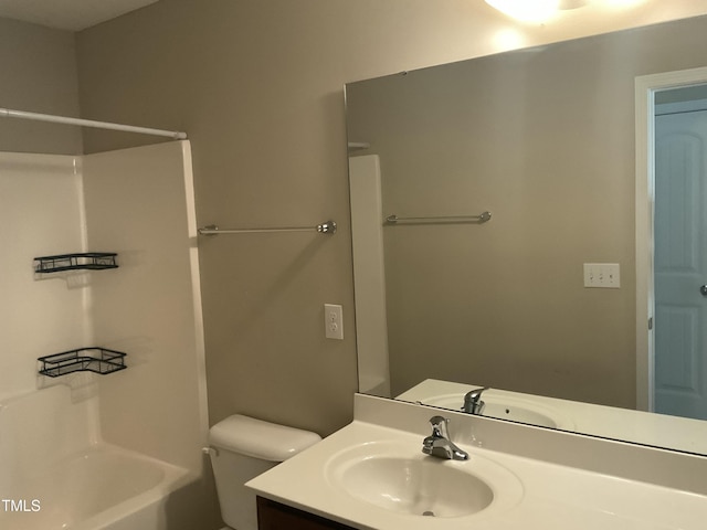 bathroom with vanity, toilet, and bathtub / shower combination