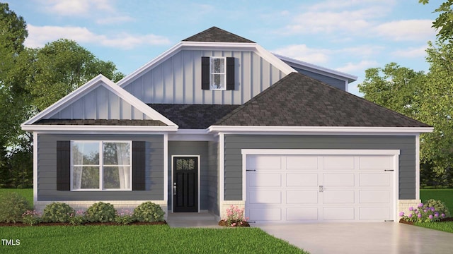 view of front of home featuring a front lawn, roof with shingles, board and batten siding, concrete driveway, and an attached garage