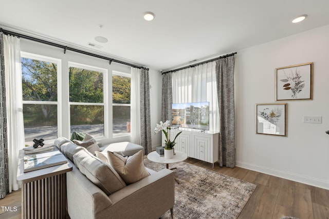 sitting room featuring recessed lighting, baseboards, and wood finished floors