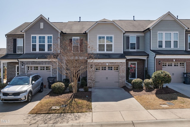 view of property with brick siding, concrete driveway, and a garage