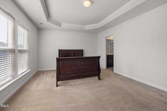 bedroom with visible vents, light carpet, a raised ceiling, crown molding, and baseboards