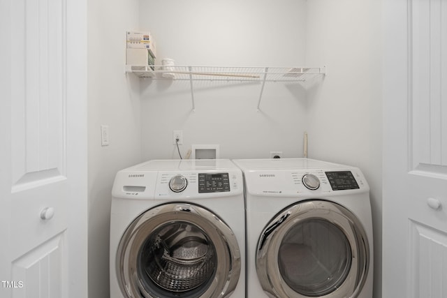 laundry room featuring laundry area and washer and clothes dryer