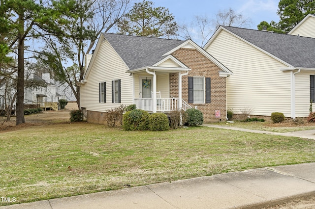 view of front of house featuring crawl space, brick siding, a front lawn, and a shingled roof