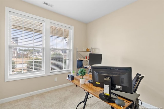 carpeted home office featuring baseboards and visible vents