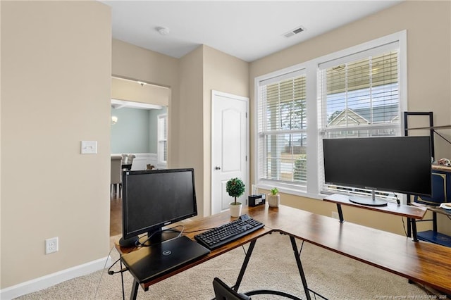 home office featuring baseboards and visible vents