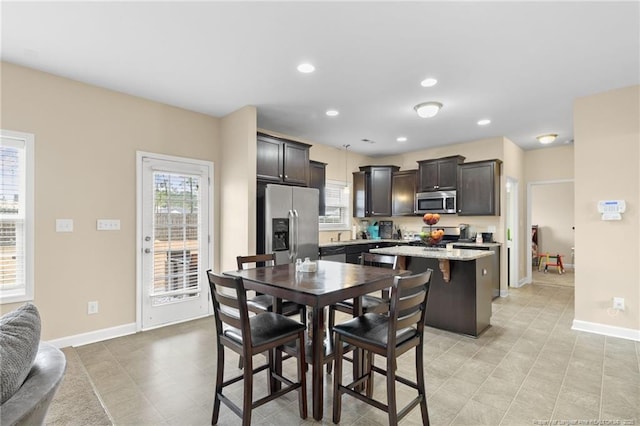 dining area featuring recessed lighting and baseboards