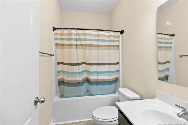 bathroom featuring toilet, shower / bath combo, and vanity