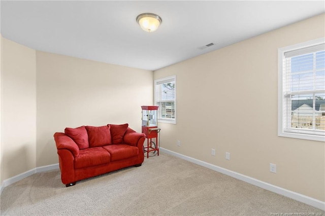 sitting room featuring baseboards, carpet floors, and visible vents